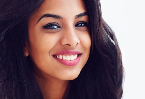 Closeup,Portrait,Of,Beautiful,Young,Smiling,Indian,Woman - Gum Whitening Explained Gum Bleaching in Los Angeles Dr. Farnoosh